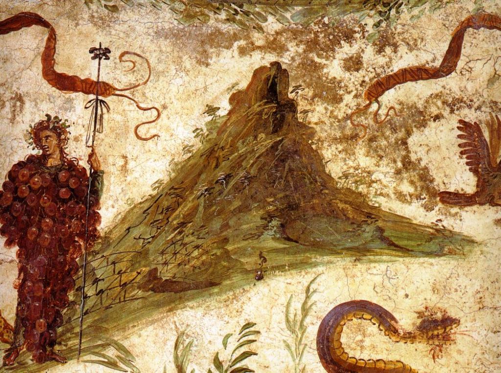 Museo Archeologico Nazionale di Napoli (inv. nr. 112286). Da Pompeii, Casa del Centenario (IX, 8, 3-6) - Affresco del larario della casa, con Bacco in forma di grappolo d'uva, che versa del vino al suo animale preferito, la pantera; in alto un festone con bende ed uccelli; in basso il serpente agatodemone genius loci, indirizzato verso un altare cilindrico; il monte visibile è presumibilmente il Vesuvio per come appariva prima dell'eruzione del 79 d.C., caratterizzato da una sola cima, e fittamente ricoperto di vegetazione, fra cui si riconoscono filari di vitigni ai suoi piedi